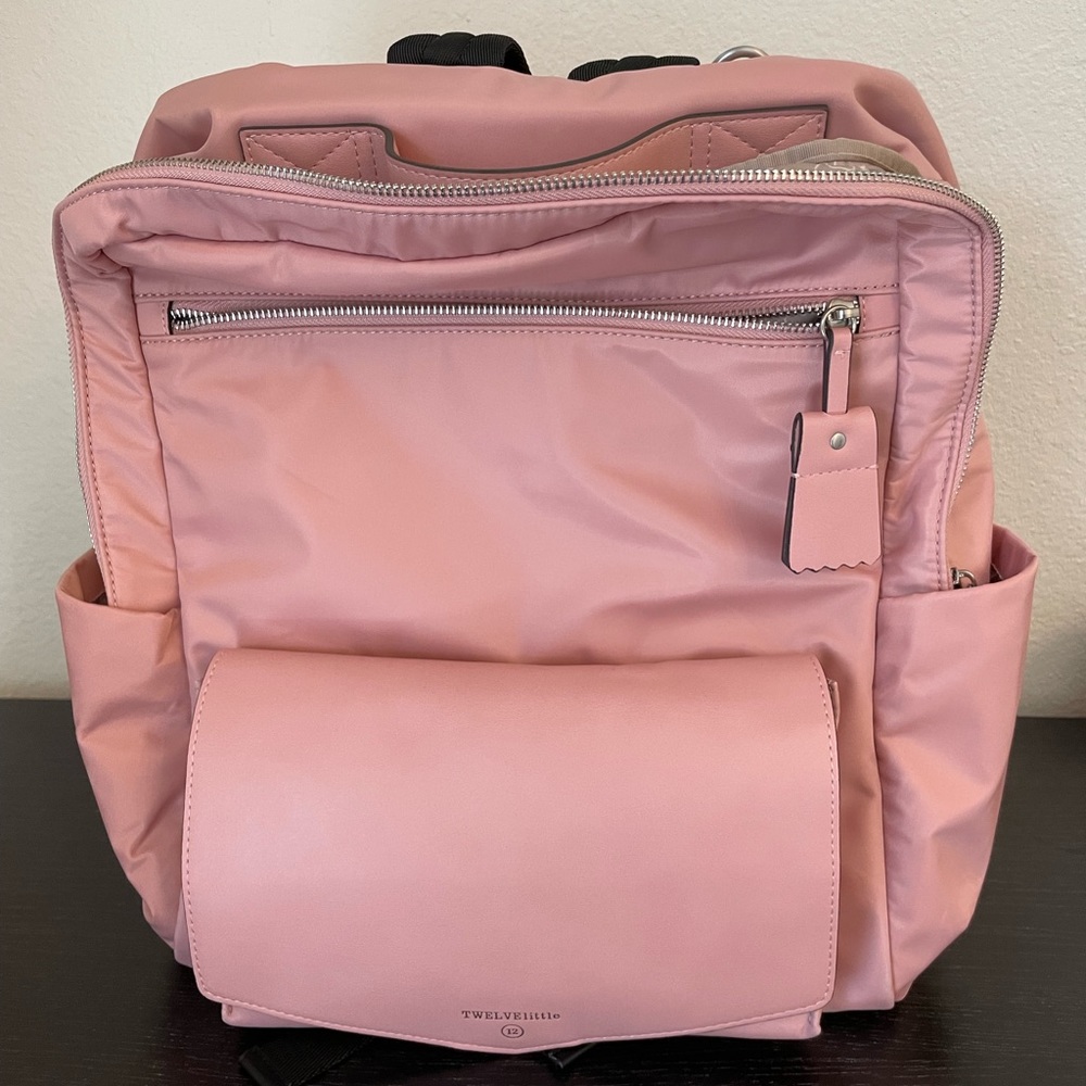 Pink twelve little Peek-a-Boo backpack diaper bag